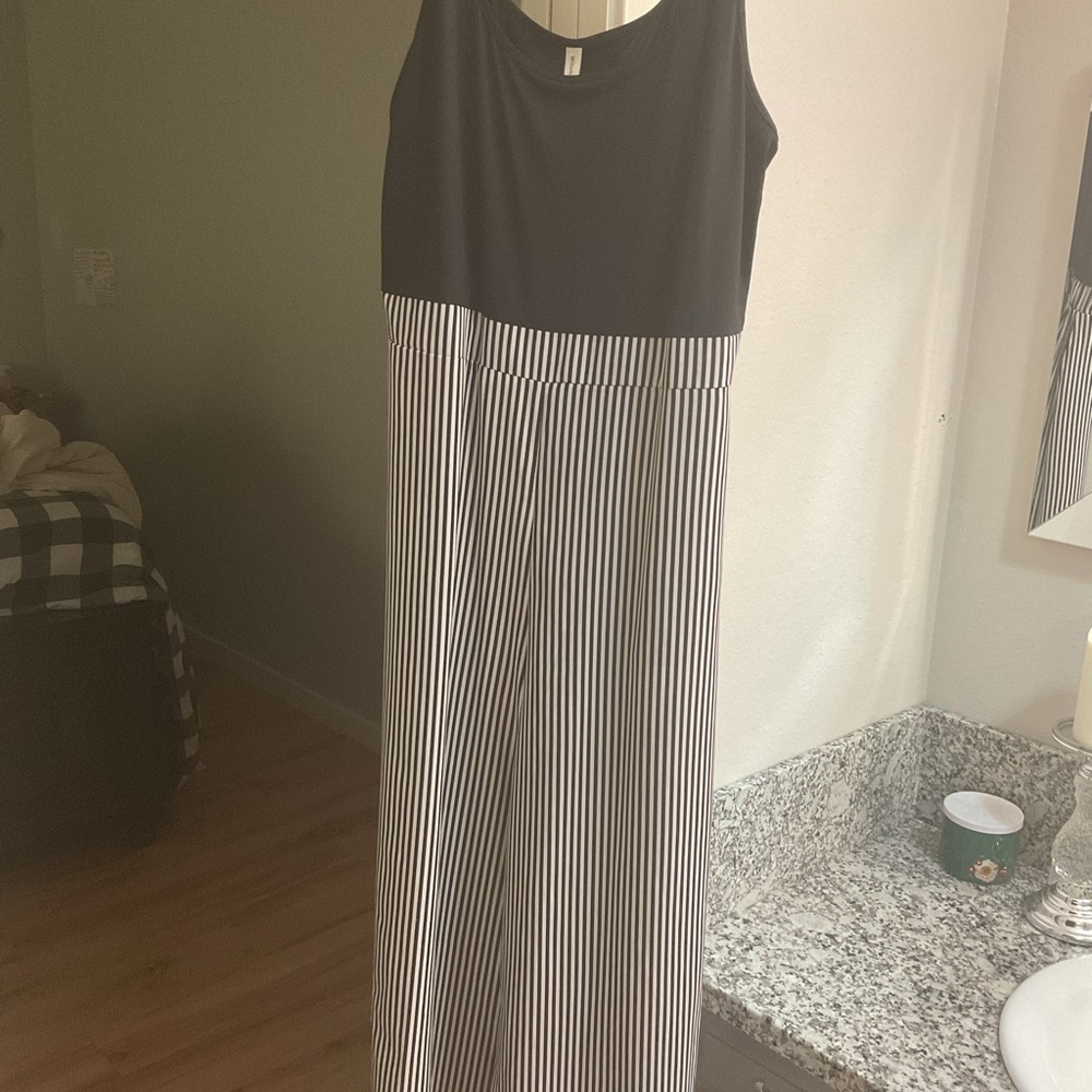 Sleeveless Black Top with Black-and-White Striped Wide-Leg Jumpsuit